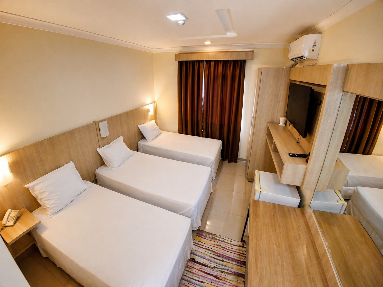 Habitación triple, con tres camas individuales